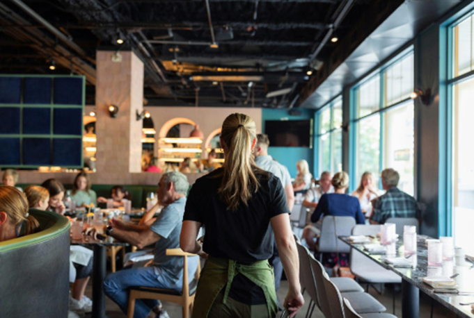 Waiter Serving at casual dinner